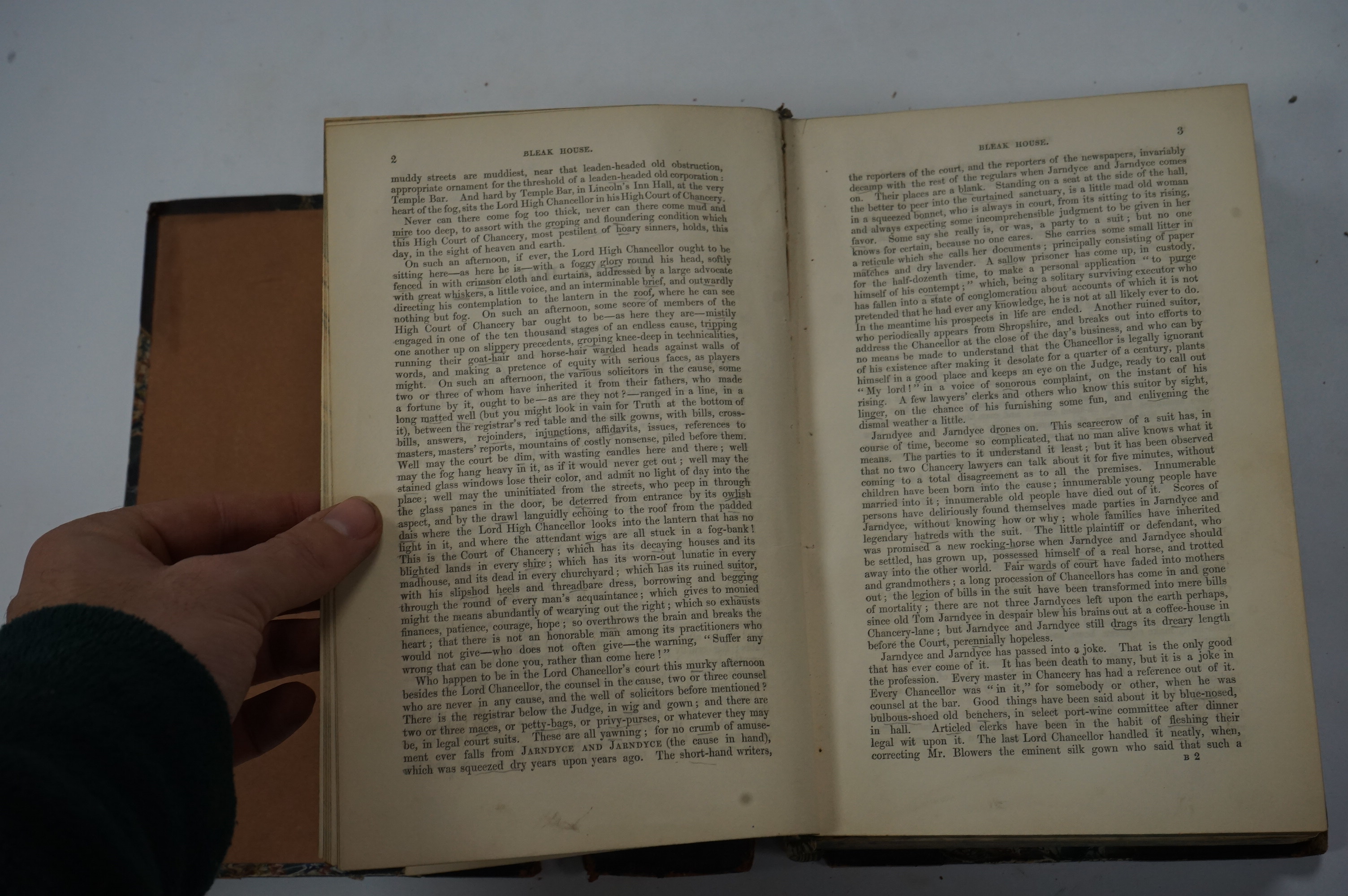 Dickens, Charles - Bleak House. First Edition. pictorial engraved and printed titles, frontis and 38 plates (by H.K. Browne); contemp. half calf and marbled boards (distressed), gilt decorated panelled spine and marbled